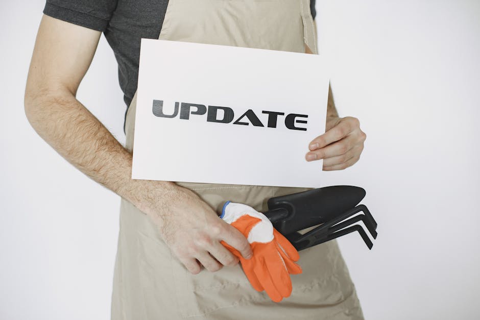 Landscaper working on garden design, discussing project details with a homeowner in a lush outdoor setting.